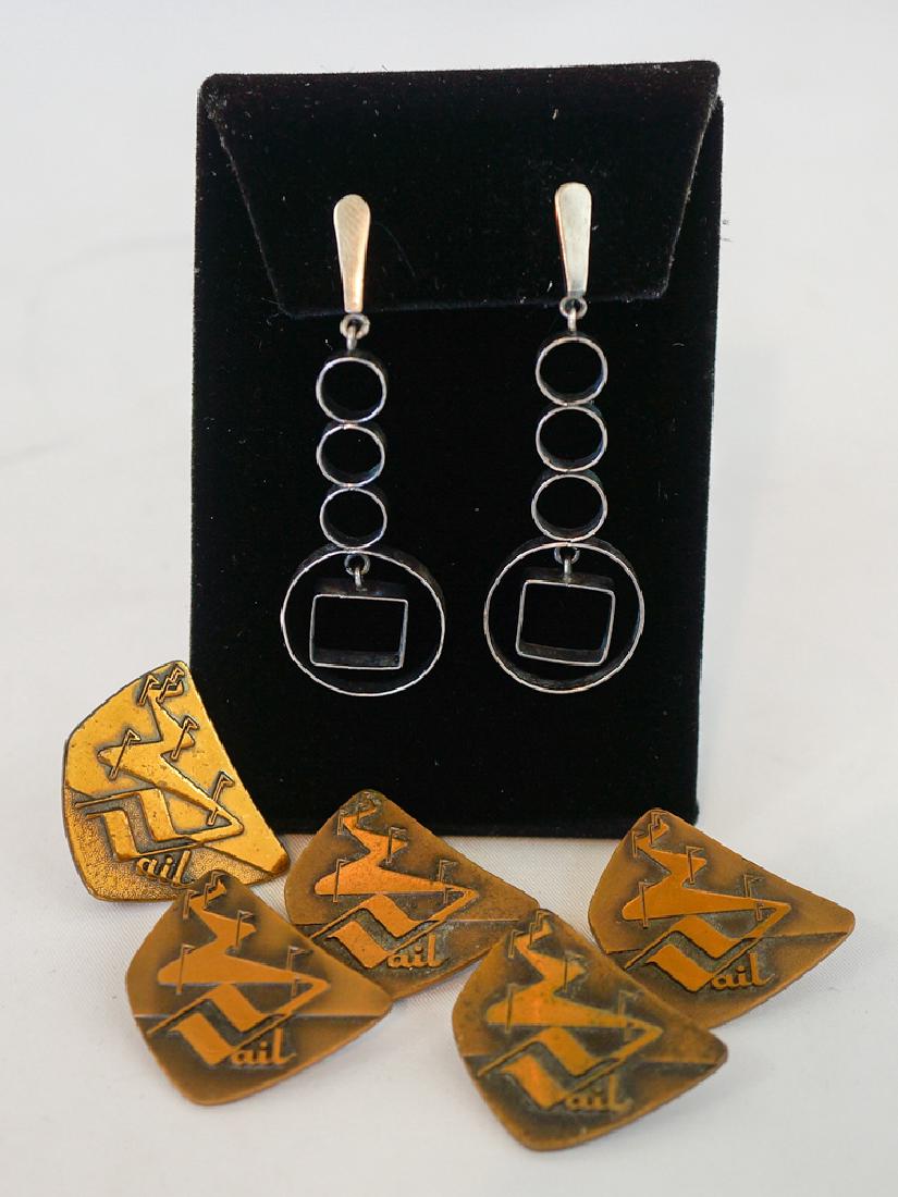Polly Stehman Signed Sterling Earrings and Pins: Mid-century Huguenein Vail ski pins (5) measuring 1 1/8" and a pair of Polly Stehman sterling modernist earrings. They measure 2.25". We ship most items in house. Exclusions include furniture, oversiz