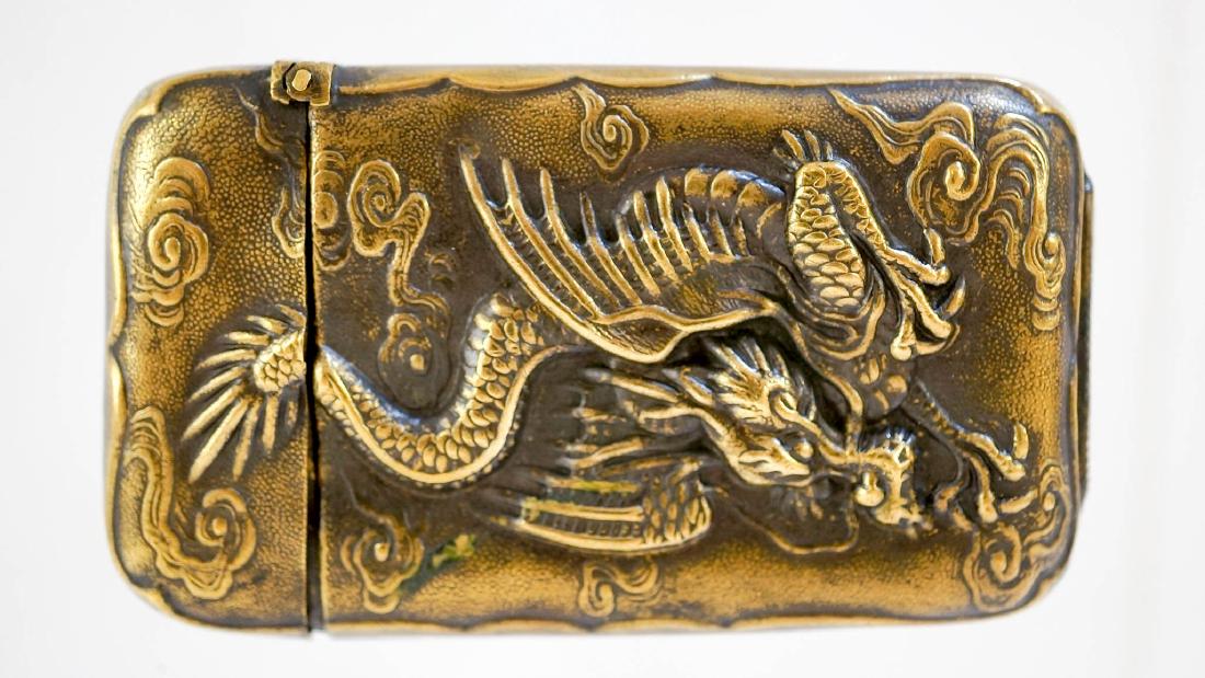 Antique Japanese Chinese Brass Dragon Match Safe: Antique Japanese or Chinese brass Dragon match safe. Measures 2 5/8" x 1 1/2" (6.75 cm x 4 cm). We ship most items in house. Exclusions include furniture, oversized framed artwork and heavier items. P