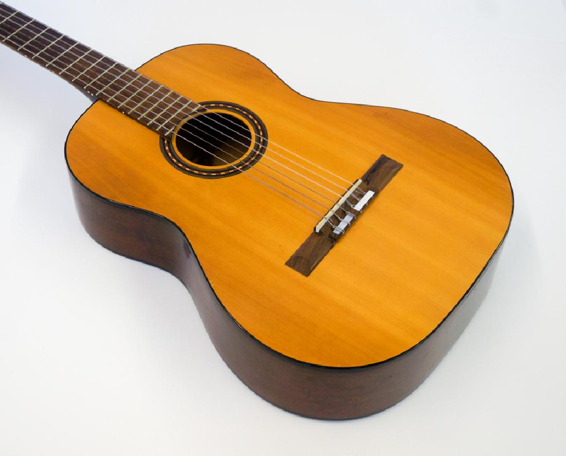 1966-68 Gibson C-2 Classical Guitar: 1966-68 Gibson C-2 Classical guitar with case. Serial number 407,556. Very good to excellent condition with no cracks, damage or repairs. Includes hard case. We ship most items in house. Exclusions in