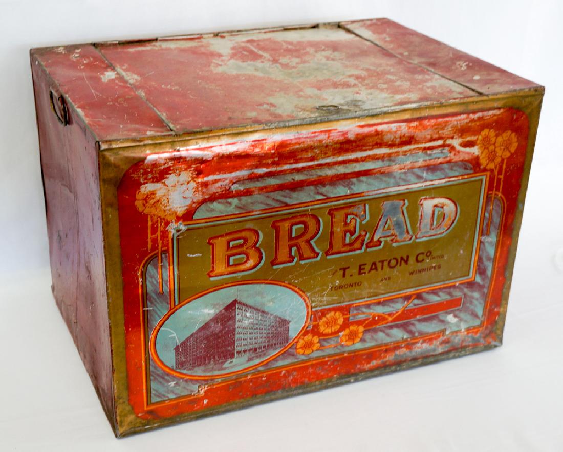 T. Eaton Antique Tin Bread Box: T. Eaton & Co. antique tin bread box. Measures 19.25" x 13.5" x 13.5". We ship most items in house. Exclusions include furniture, oversized framed artwork and heavier items. Please inquire for shippin