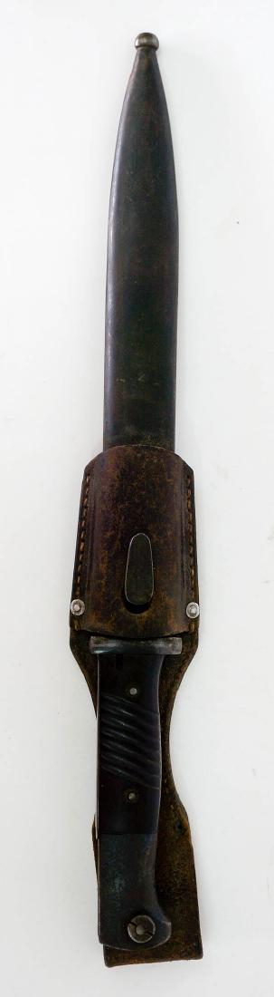 WWII German Bayonet For Mauser 98: [WWII, WW2, Bayonet] World War II German bayonet for Mauser 98. 10" blade (blue), brown composition grips with frog and matching scabbard. Marked F.W. Holler and 8753. Circa 1942, very good condition.