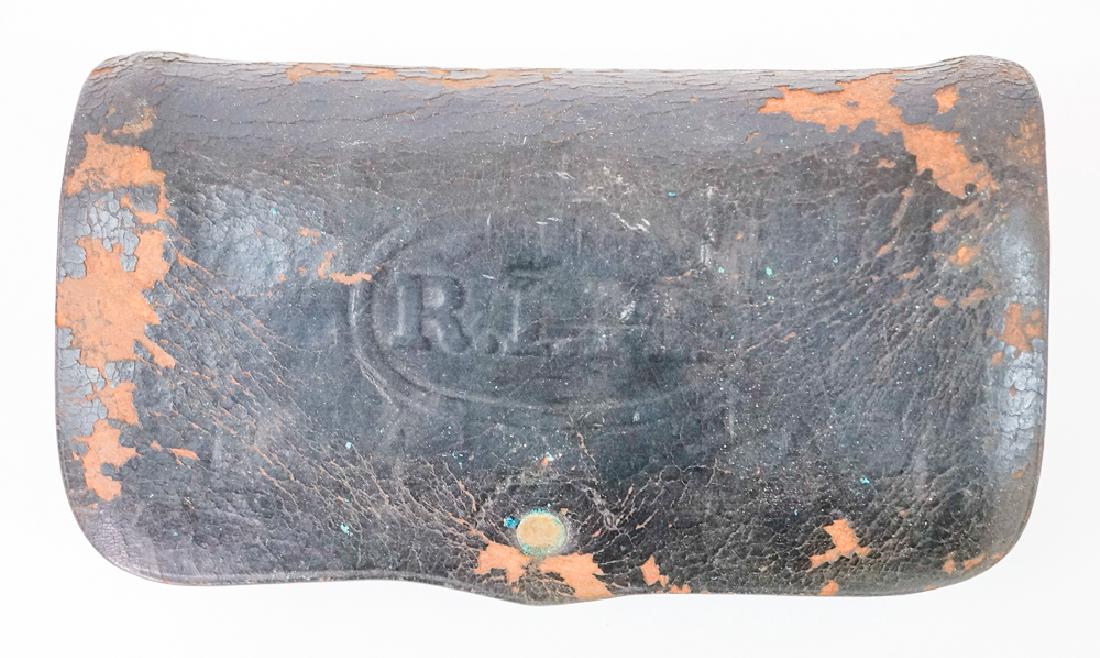Rhode Island Militia Cartridge Box: Rhode Island Militia R.I.M. cartridge box. Black leather, embossed, Watervliet Arsenal .45-70 U.S. Army cal. Indian Wars, leather flaked, tab broken but with piece. Provenance: Estate of Earl E. Bucha