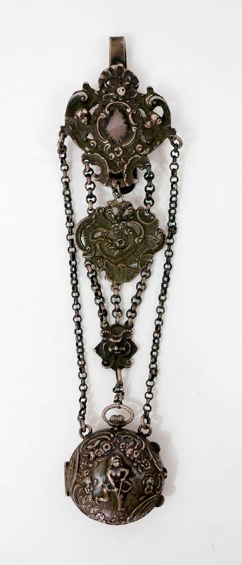 Late 18th C./19th C. Silver Chatelaine Watch Case: A late 18th century or early 19th century silver chatelaine watch case. Appears to have Dutch hallmarks. Measures 7.25" x 1.75", weighs 86 grams. Marks include four dots around a cross and a row of th