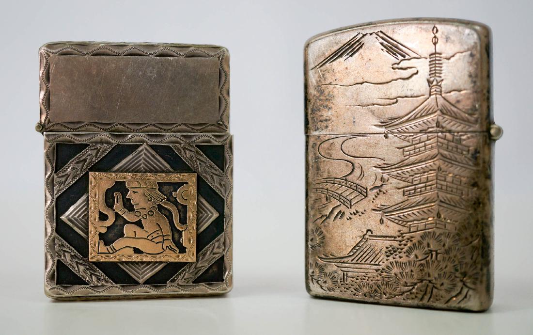 Two Vintage Sterling Lighters, WWII: Two vintage sterling silver lighters including a Japanese WWII engraved lighter. The Lighter is marked Zippo but no sign of Zippo on the case. We ship most items in-house with the exception of firearm