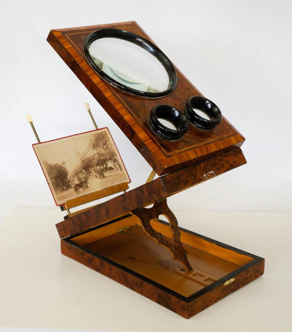 Antique French Burl and Ebonized Graphoscope: Antique French Burl and Ebonized Graphoscope. Measures 10.75" x 7" x 2.75". The clasp holding the viewer up needs repair. We ship most items in-house with the exception of firearms, large and/or heavy