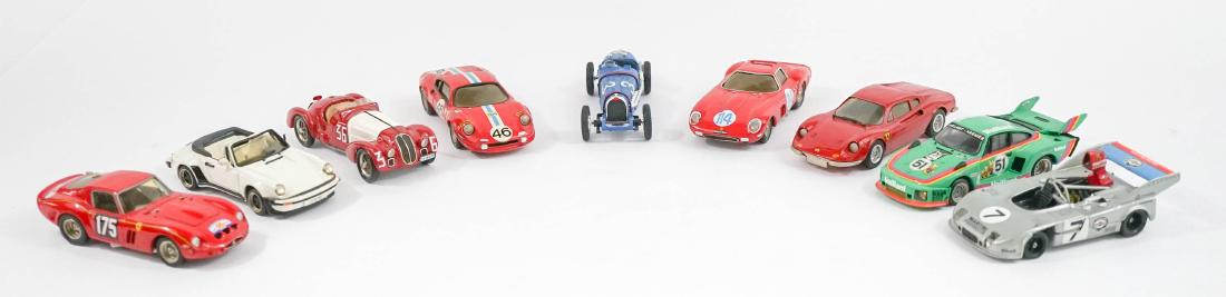 Group of Nine 1:43 Scale High-End Model Cars: A group of nine high-end 1:43 scale model cars. Some retain original price stickers showing purchase prices over $100 each. We ship most items in-house with the exception of furniture, large or heavy 
