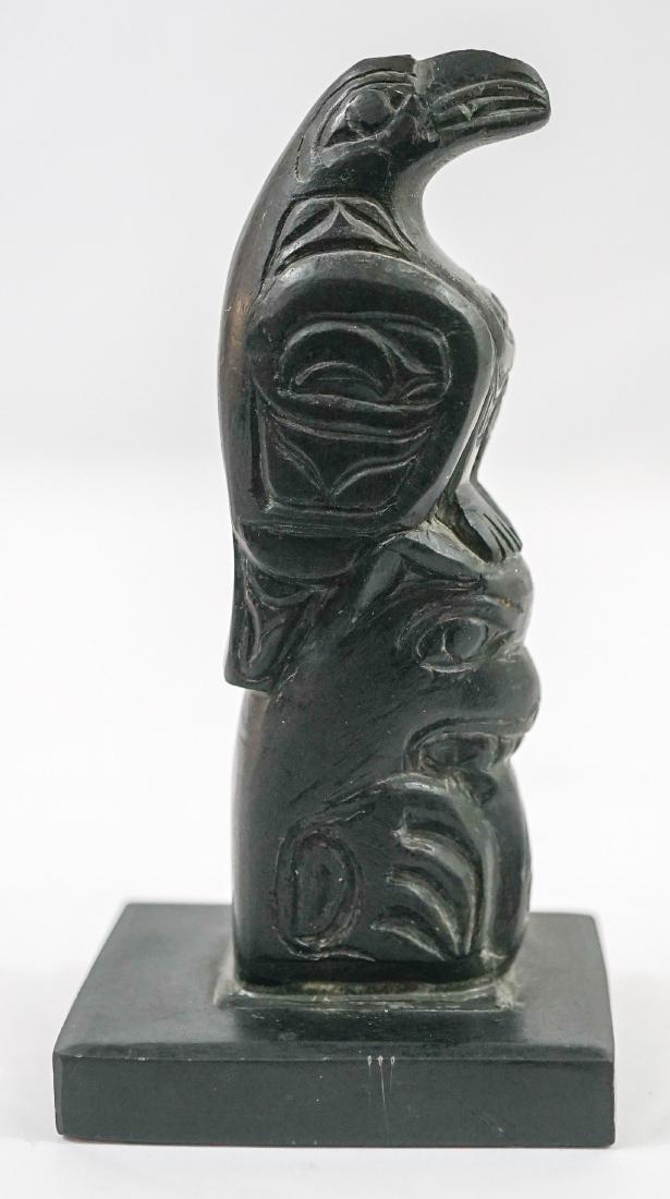 Northwest Coast Haida Argillite Carved Totem: Haida Argillite carved totem with raven and halibut. Measures 4 3/4" x 2 3/8" x 2". Excellent condition. We ship most items in this auction in-house with the exception of furniture, large or heavier a