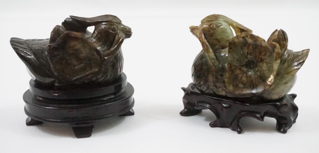Chinese Hardstone Mandarin Ducks w/Lotus Blossom: Pair Chinese Hardstone Mandarin Ducks w/Lotus Blossom. [2] vintage mirror image Chinese Hardstone Ducks with Lotus leaf and blossom in their bill. On wooden stands. Excellent condition. Measure 4 in x