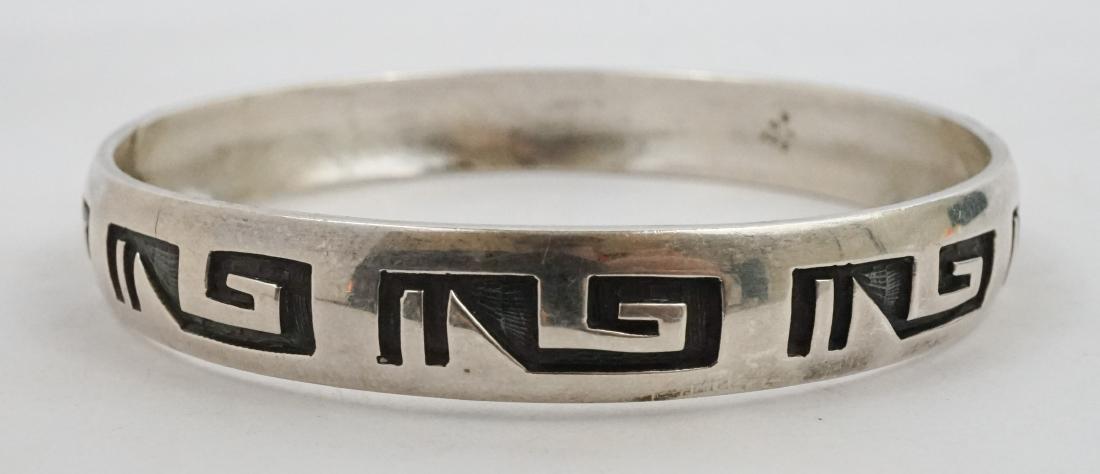 Bernard Dawahoya Hopi Sterling Bracelet: Bernard Dawahoya signed Hopi sterling bracelet. Measures 7/16" in width, inside circumference is 8" and weighs 30 grams. Excellent. We ship most items in-house with the exception of furniture, large o
