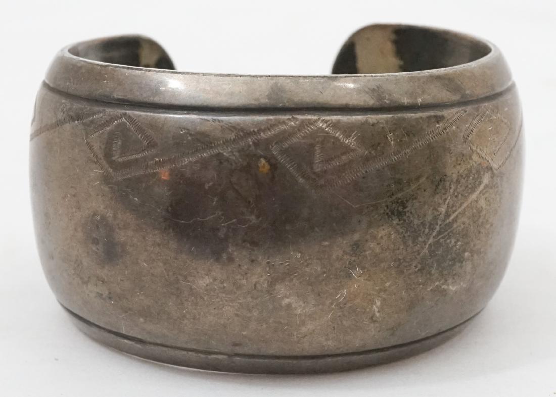 James Little Signed Navajo Cuff Bracelet: James Little signed Navajo cuff bracelet. Signed with Little's initials within an arrowhead. Measures 1 3/8" x 2 1/2" x 2". Not marked for silver content. We ship most items in-house with the exceptio