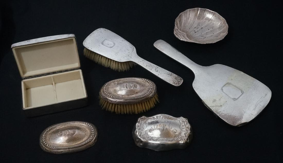 A Group of Sterling and Silver Plate Dresser Items: A group of old sterling and silver plate dresser items. Includes a sterling brush and mirror, sterling brush tops. Includes unmarked box and soap dish likely silver plate. We ship most items in-house