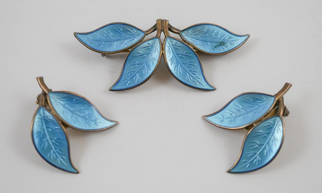 David Andersen Norway Sterling Pin and Earrings: David Andersen Norway Sterling pin and earrings. Pin measures 2.5" x 1.25". Earrings measure 1" x 1 3/8". The pin has one small stain of area with foxing. We ship most items from this auction in house