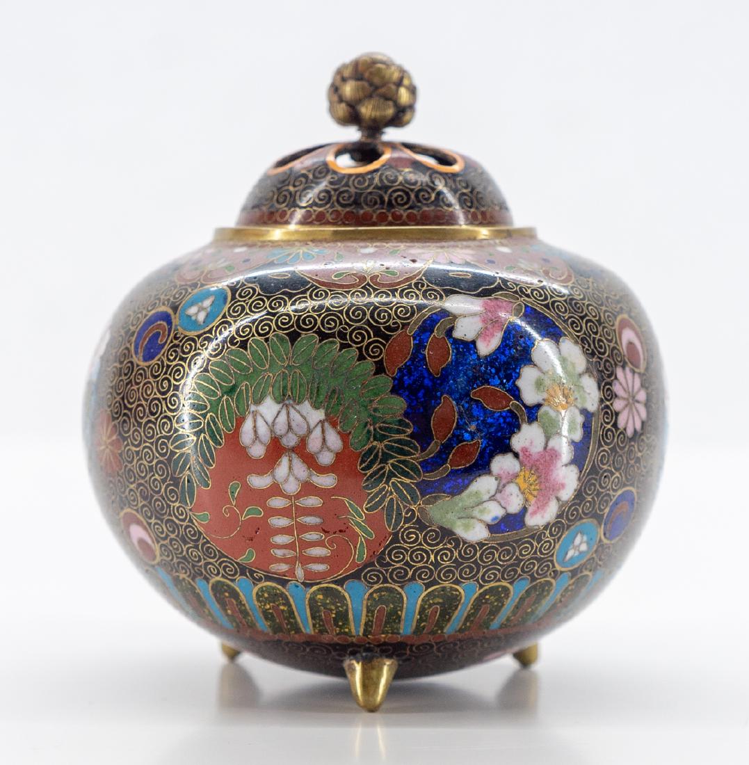 Japanese Maiji Covered Koro Cloisonne Censer: Japanese Meiji period cloisonne covered censer. Finely wired with a design of six panels of floral, bamboo, plum wisteria and small roundrels throughout. Measures 4 1/8" x 3 3/4". Excellent condition.