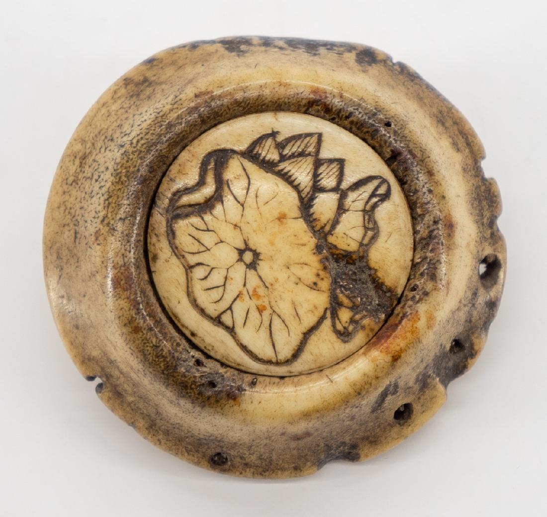 Japanese Manju Netsuke Stag Horn: Antique Manju netsuke of stag horn, incised design of lotus. Measures 2" diameter. We ship most items in this auction in house and gladly combine shipping if possible of multiple items.