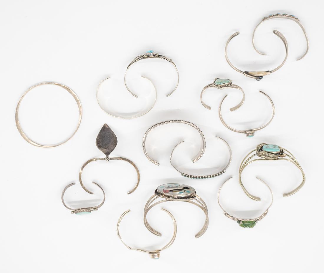 Collection of Fifteen Southwest Cuff Bracelets: Collection of fifteen old Native American cuff bracelets. Assorted sizes. We ship most items in this auction in house and gladly combine shipping if possible of multiple items.