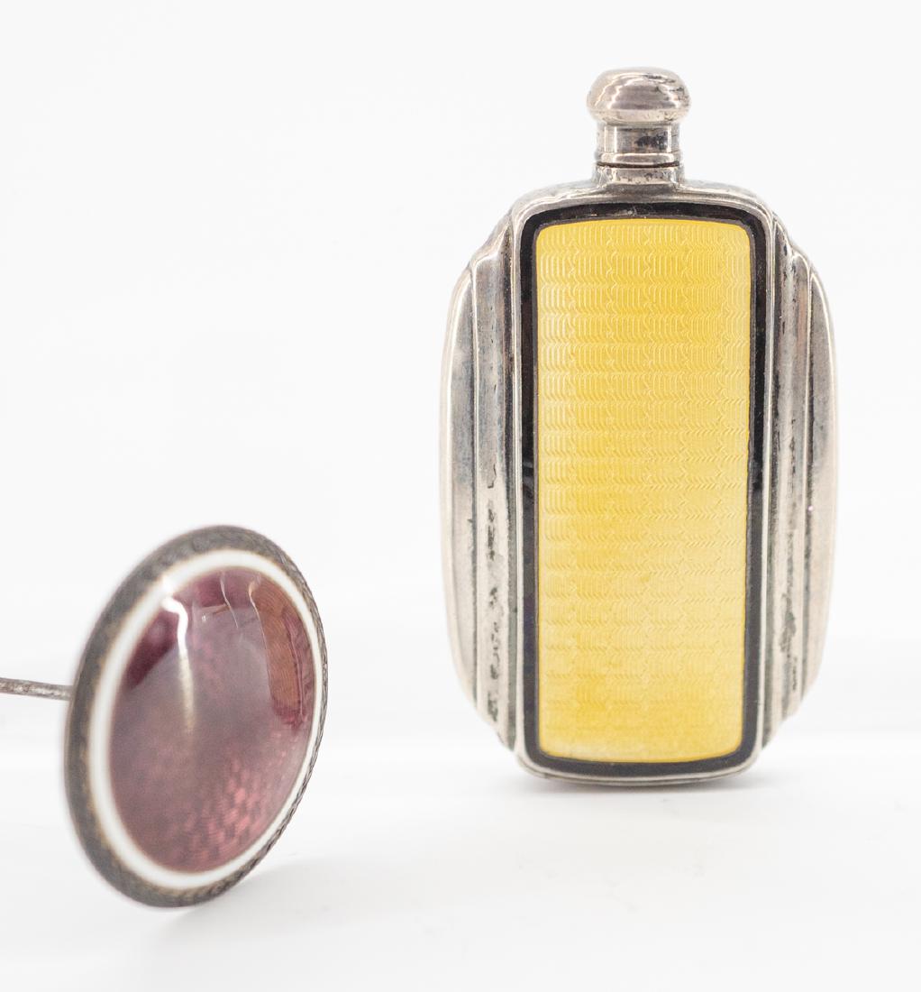 Sterling and Enamel Perfume Bottle and Hat Pin: An antique sterling and enamel perfume bottle measuring 2" x 1 1/8" and a hat pin measuring 1" diameter x 7.25". Very good to excellent condition. We ship most items in this auction in house and gladl