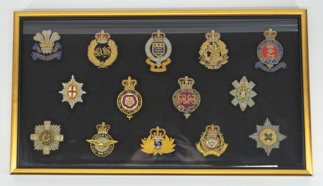Collection of Framed British Military Patches: Collection of framed British military patches. Fourteen British patches professionally framed making for a nice display. Measures 15" x 27". Excellent condition. We ship most items in this auction in