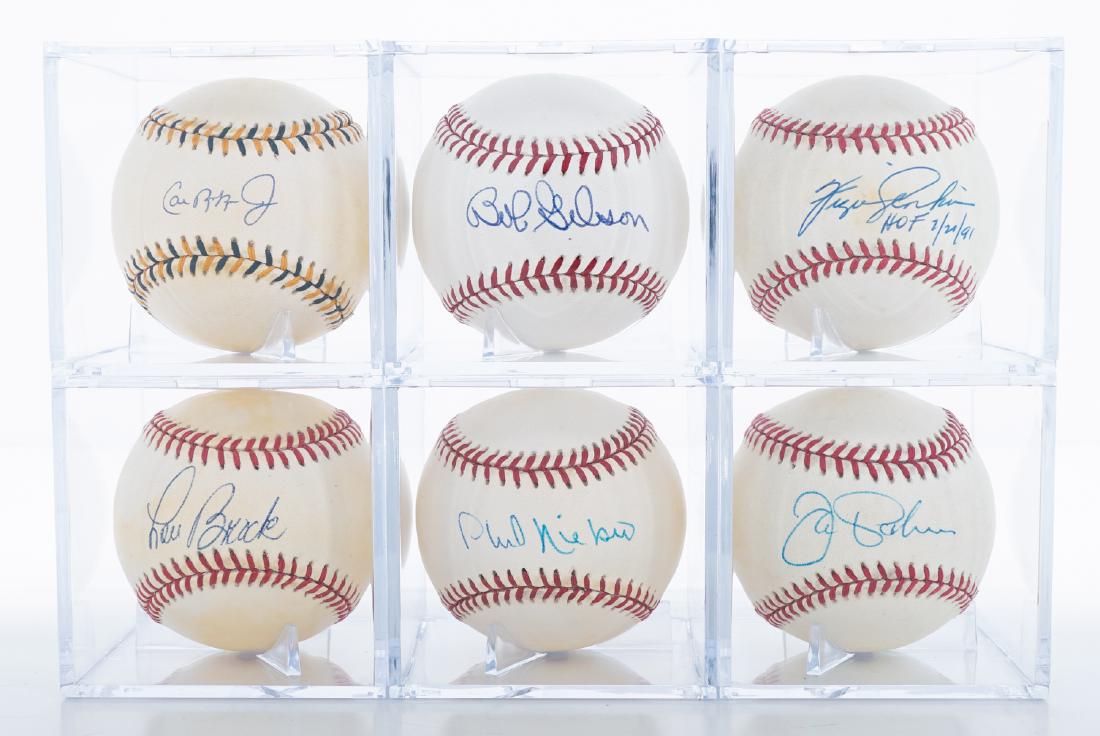 Six Baseballs Signed By Hall Of Famer's PSA/DNA: Six baseballs signed by Hall of Famer's. All come with PSA/DNA COA. Includes Bob Gibson, Fergie Jenkins, Jim Palmer, Cal Ripken, Jr. Lou Brock and Phil Niekro. We ship all items from this auction in-h