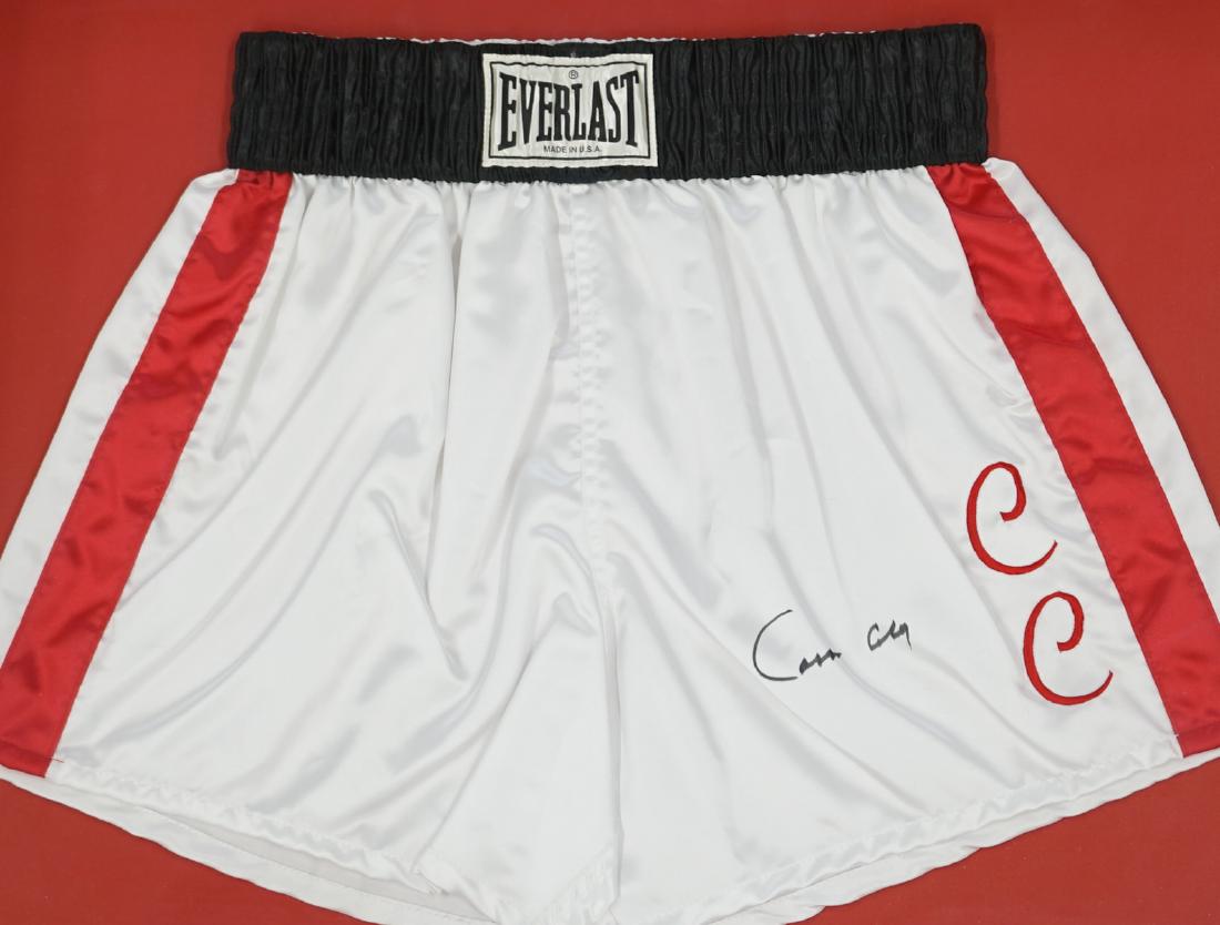 Cassius Clay Signed Everlast Trunks: Muhammad Ali has signed "Cassius Clay" on this pair of replica trunks from when he fought as Cassius Clay. These are a re-creation of the Everlast trunks from the night he won his first heavyweight ch