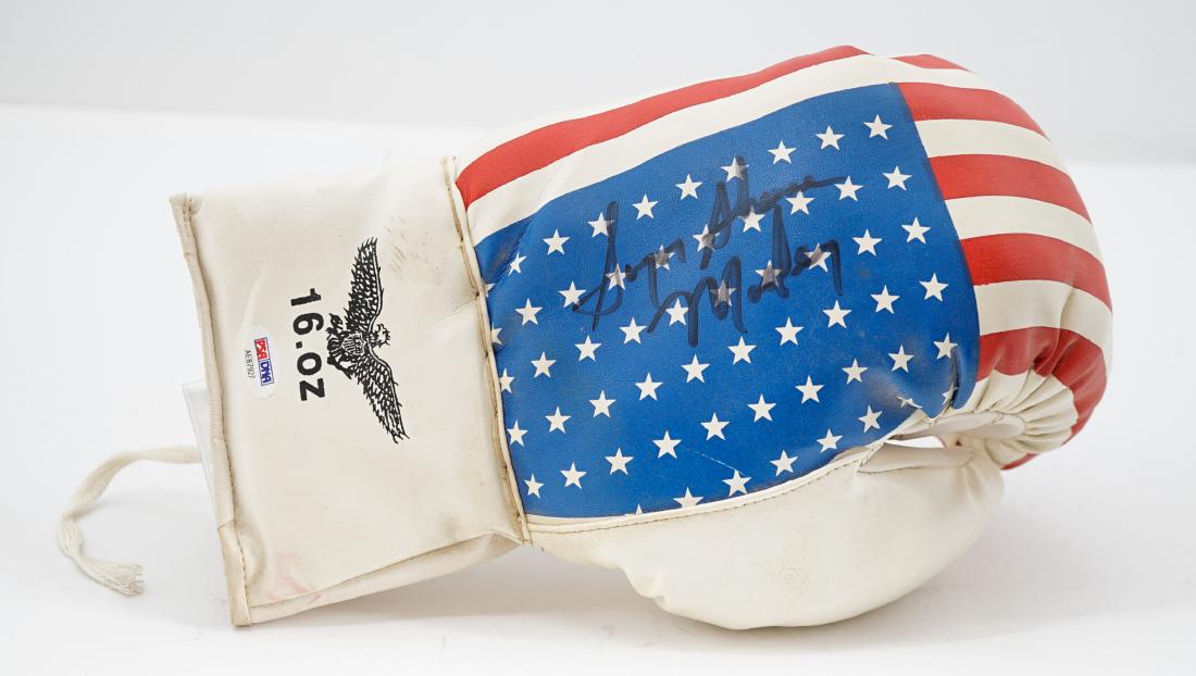 Sugar Shane Mosely Signed Boxing Glove PSA/DNA: Sugar Shane Mosely signed boxing glove. Includes PSA/DNA COA #AE87927. We ship all items from this auction in-house and gladly combine shipping if possible of multiple items.