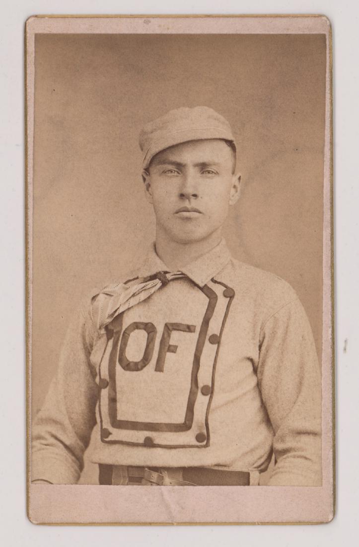 CDV Odd Fellows Baseball BBC of Vermont Ca.1870: CDV of Odd Fellows B.B.C. of White River Jct., Vermont circa 1870. A fine 19th century baseball CDV with player wearing a wonderful bib-front jersey. Measures 4.0625 in. x 2.4375 in. VG-EX/EX. Conditi