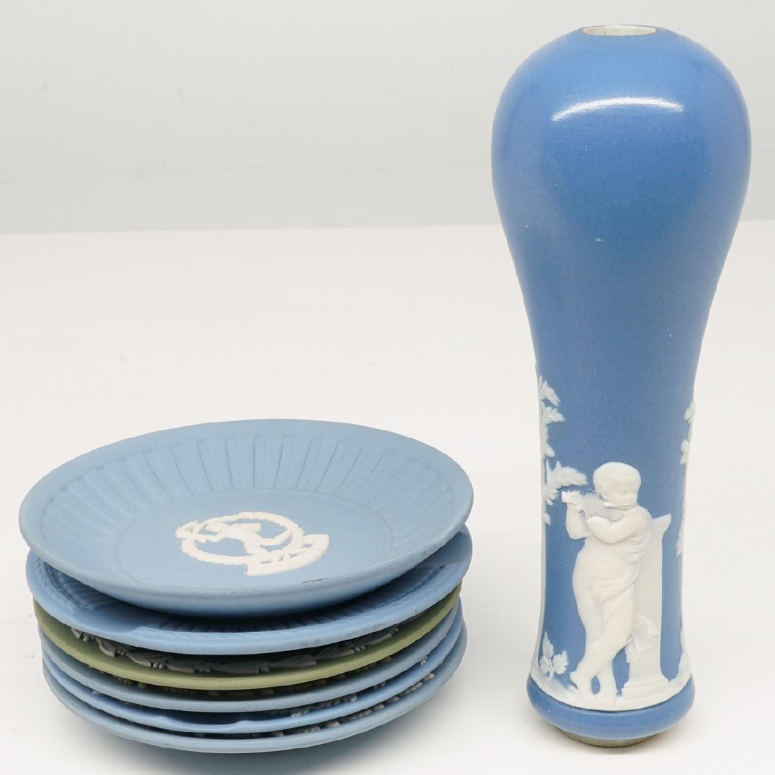 Wedgewood Tap Handle and Commemorative Plates: Wedgewood tap handle and commemorative small plates. Includes the Spirit of Ecstasy Rolls Royce design, Jaguar, Olympiad XXIII and more. Seven pieces total. Plates measure 4.625 in., stein handle meas