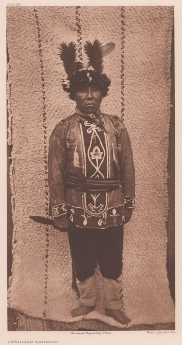 Edward Curtis Photogravure Cowichan Warrior: Edward Curtis Photogravure titled "Cowichan Warrior" plate 322. Reads "From Copyright Photograph 1912 E.S. Curtis" below image. Holland Van Gelder Paper watermark in margin. University of San Diego Bl