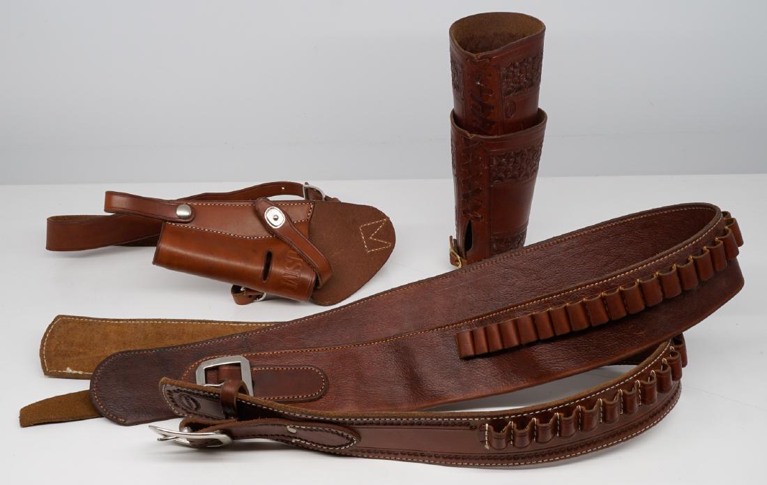 Group of Signed Leather Belts, Holster & Cuffs: A group of signed leather belts, holster and cuffs. Cuffs are marked "Jeff Morrow", one belt stamped "R.M. Bachman, one belt stamped "M. Shelhart & Co." and shoulder holster marked "El Paso Saddlery".