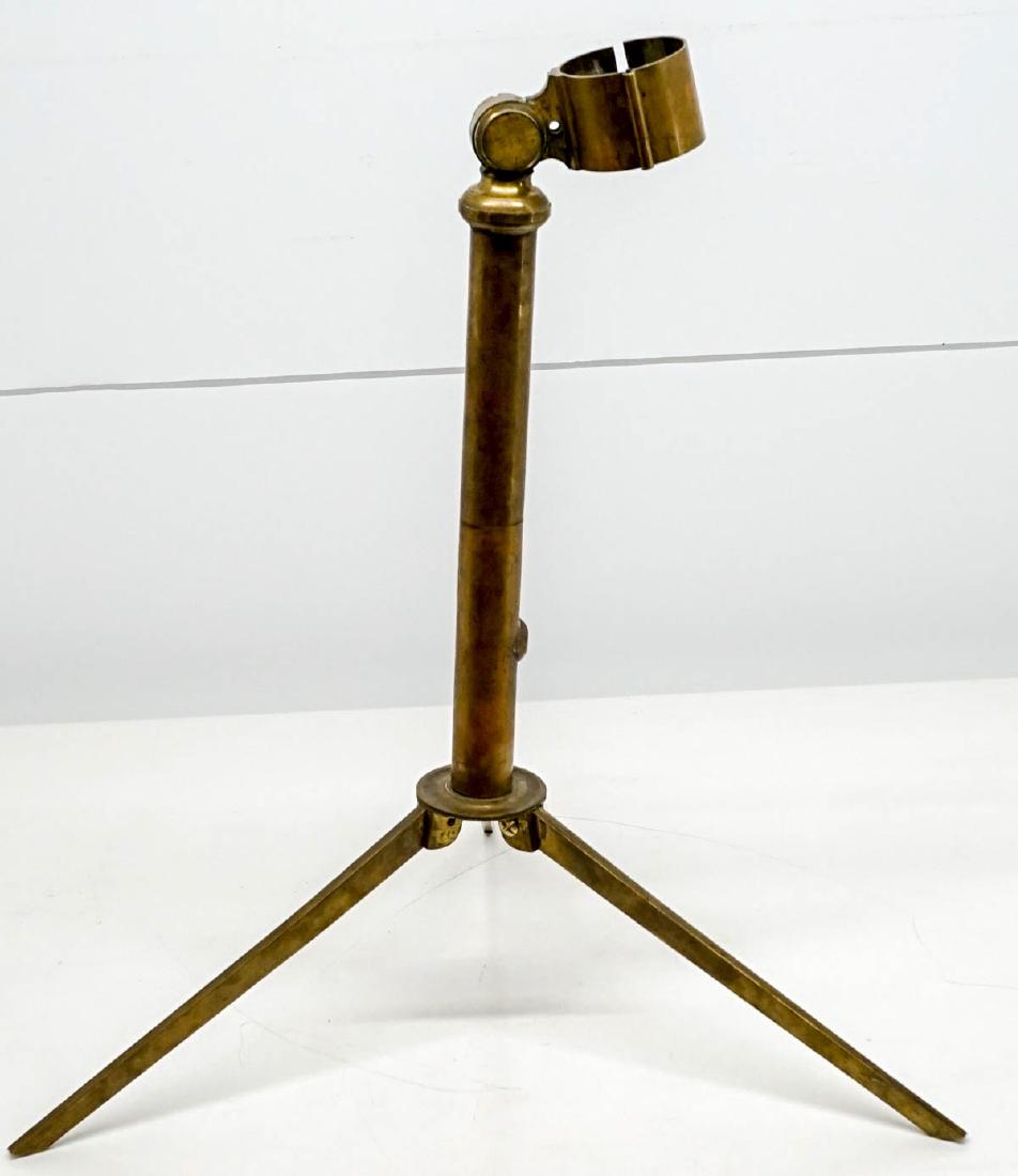 Antique Brass Telescope Tripod Stand: Antique brass telescope stand. Measures 24 in. in length laying flat, ring for telescope measures 2 in. inside circumference. Ring arm does not rotate or move, may be frozen or have tightened. Is miss