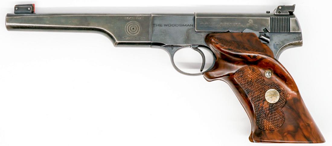 Colt Woodsman 22L caliber Semi-Auto Target Pistol: Colt Woodsman 22 Long Rifle caliber semi-auto pistol. With after market soft case. Barrel length 6.625 in. Serial number MT10636. Good condition with pitting on barrel. Provenance: Estate collection, 