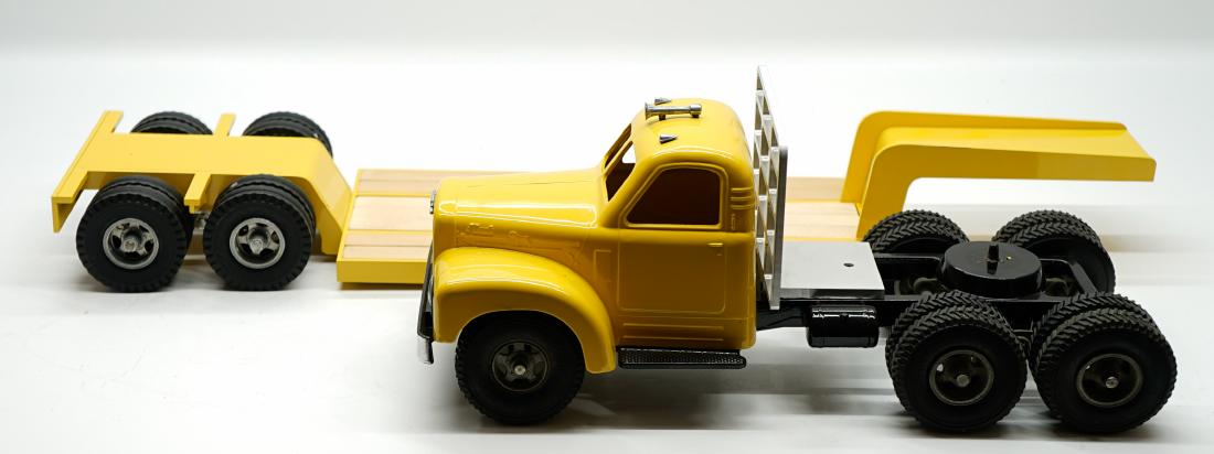 Smith Miller Custom All-American Lowboy SM3006: Smith Miller Custom All-American Mack pulling a Lowboy Trailer. Marked SM3006 on base. May be a combination of original and restored parts. Measures 39.25 in. x 6.25 in. x 7 in. Some parts are or may