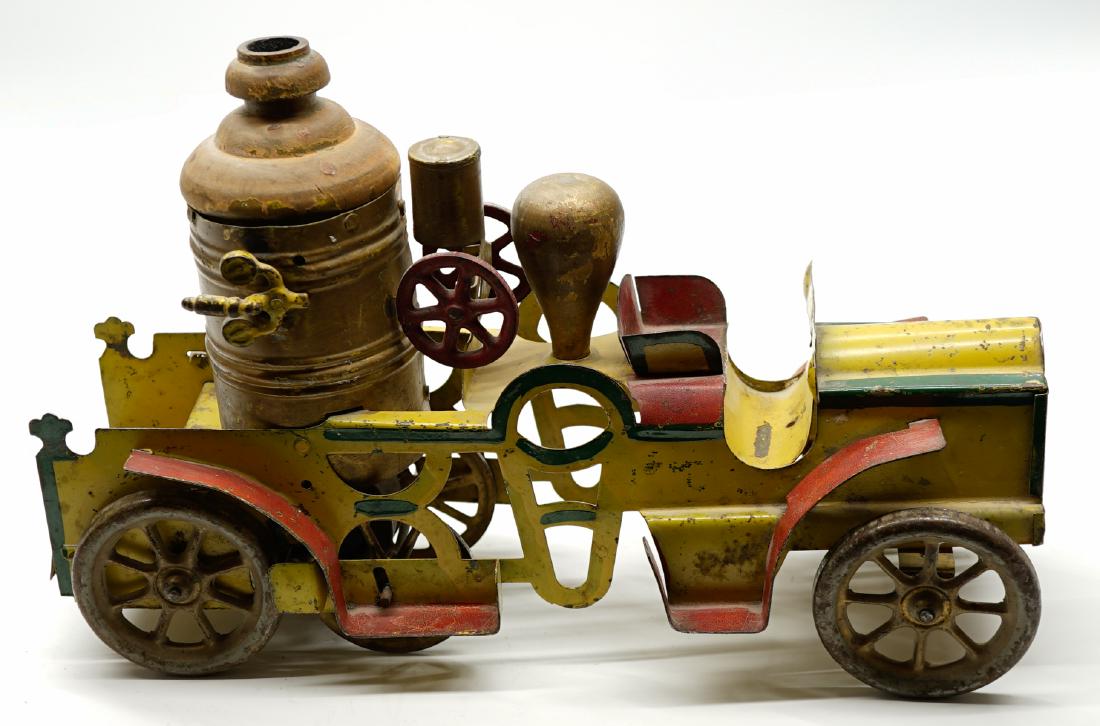 Antique Schieble Pressed Steel Fire Engine: An antique Schieble pressed steel friction fire engine. Measures 14 in. x 9 in. x 4.25 in. Appears to be all original. Wheels all move but toy does not operate. However, some toys in this collection a