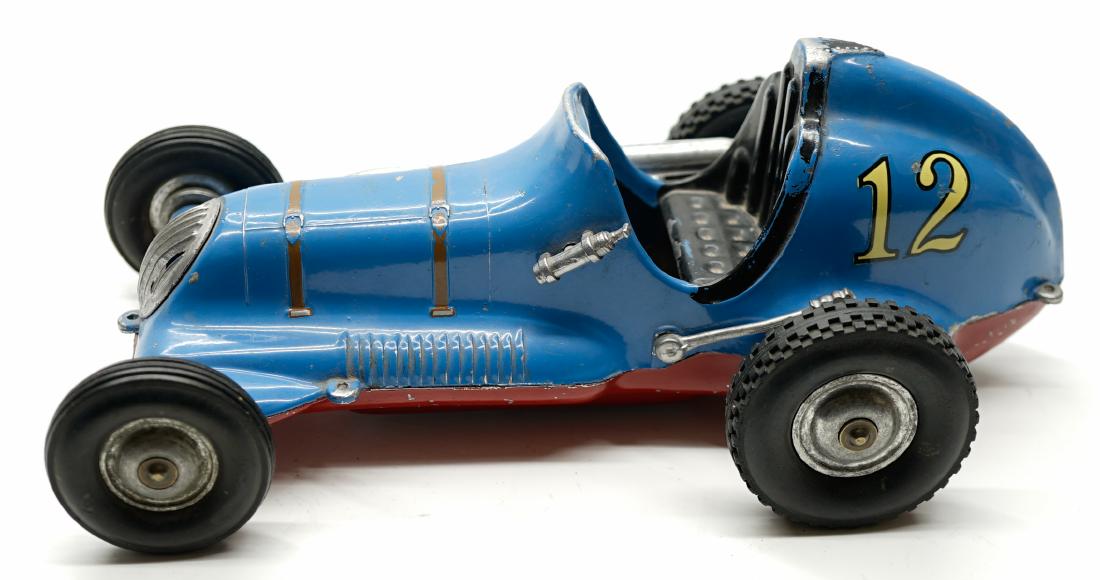 Roy Cox Thimble Drone Tether Car: Roy Cox Thimble Drone tether car. Measures 9.75 in. in length. Appears to be all original. However, some toys in this collection are restored, repainted or may have replaced parts so please review the