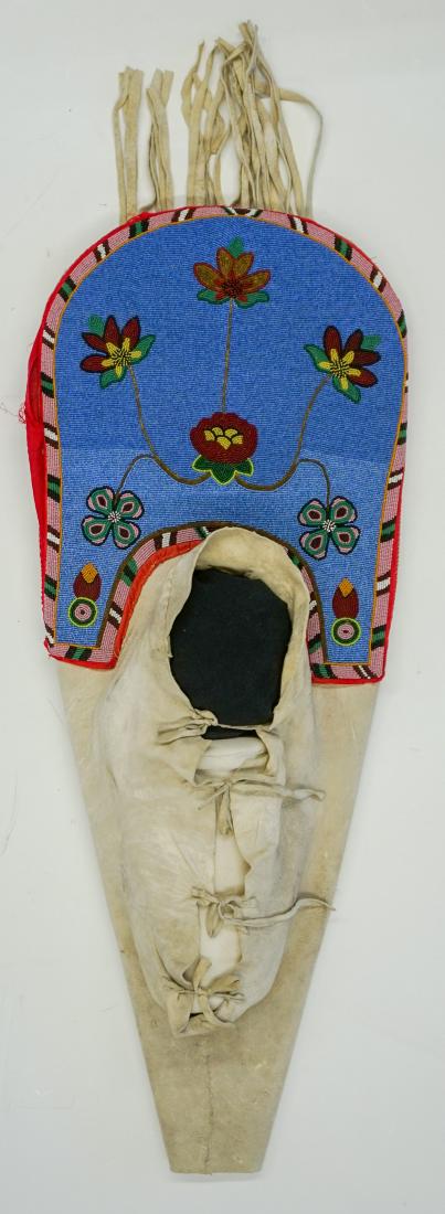 1890's Nez Perce Beaded Cradle Board: 1890's Nez Perce beaded cradle board. Measures 34.5 in. x 13 in. Very good to excellent condition. If lot is absent of a condition report a condition report may be requested via email. Condition repor