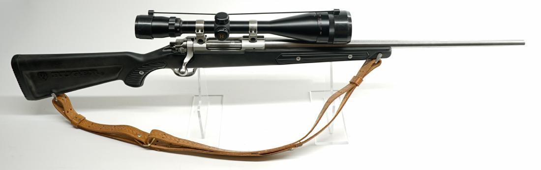Ruger M77 Mark II .223 Remington Rifle: Ruger M77 Mark II .223 Remington Rifle. Black synthetic stock, stainless barrel, banner wide angle scope 10-400 yards, sling, 23-inch barrel. Serial Number 785-45992. Excellent condition. If lot is ab