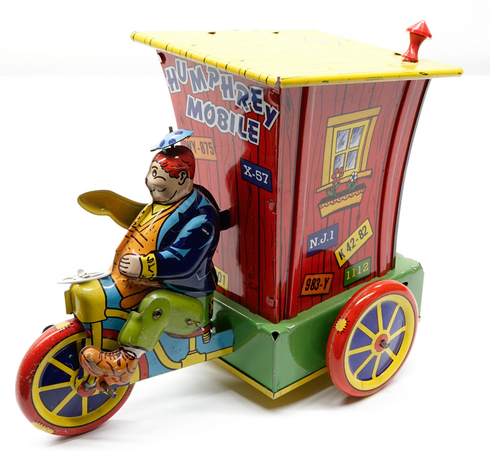 Wyandotte Humphrey Mobile Tin Wind-Up Toy: Wyandotte Humphrey Mobile tin wind-up toy. Measures 7 in. x 9 in. x 5 in. This wind-up does not seem to function entirely as it should. Overall, VG-EX. If lot is absent of a condition report a conditi
