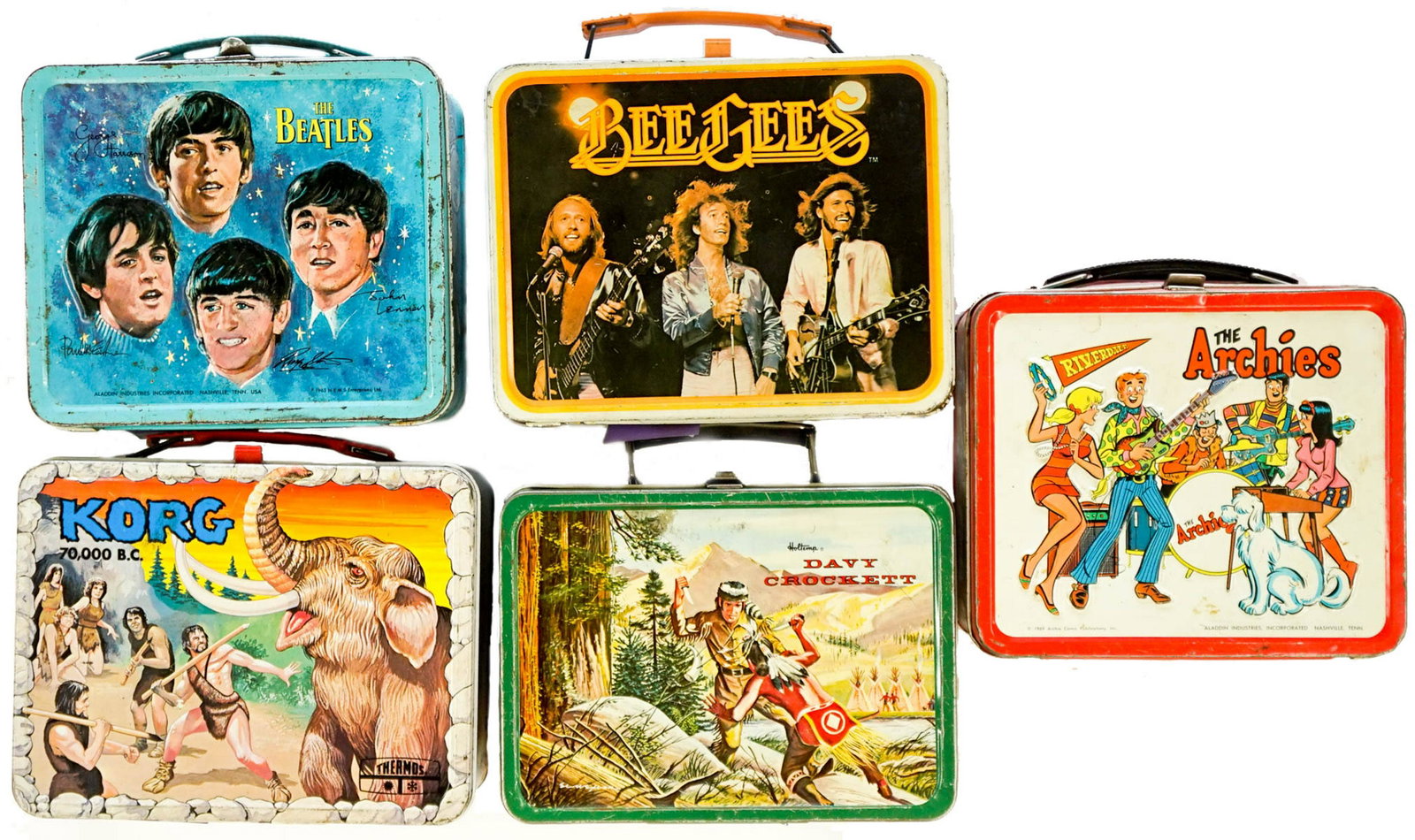 Five Vintage Lunchboxes, The Beatles and more: A group of five vintage lunchboxes including The Beatles, The Bee Gees, The Archies, Davy Crockett and Korg. Condition varies, The Beatles lunchbox is in poor to fair condition. If lot is absent of a 