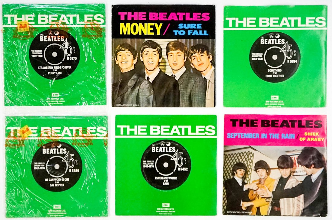 The Beatles (6) 45 RPM Records: The Beatles group of six 45 RPM Records. Includes: 1) EMI sleeve with Apple label 5814 Something / Come Together 2) EMI sleeve with Parolphone label 5452 Paperback Writer / Rain 3) EMI 5570 Strawberry