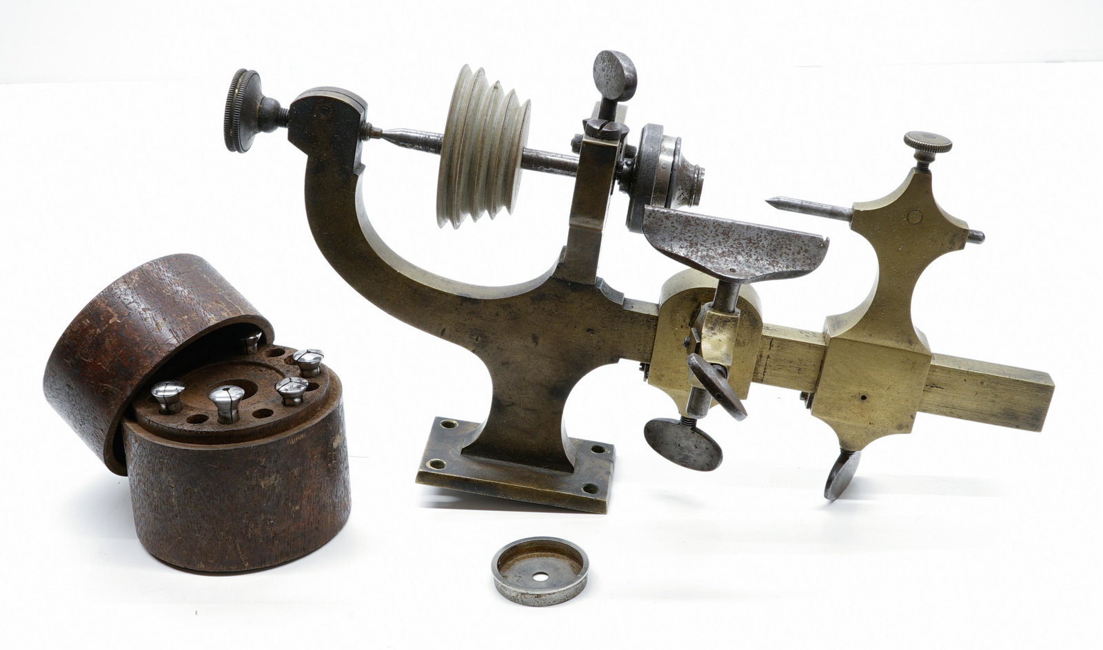 Watchmakers or Jewelers Lathe and accessories: An antique watchmakers lathe. Measures 5.75 in. x 10.75 in. x 3.5 in. Not tested and likely needs servicing. Provenance: Private Collection Missoula, Montana. If lot is absent of a condition report a