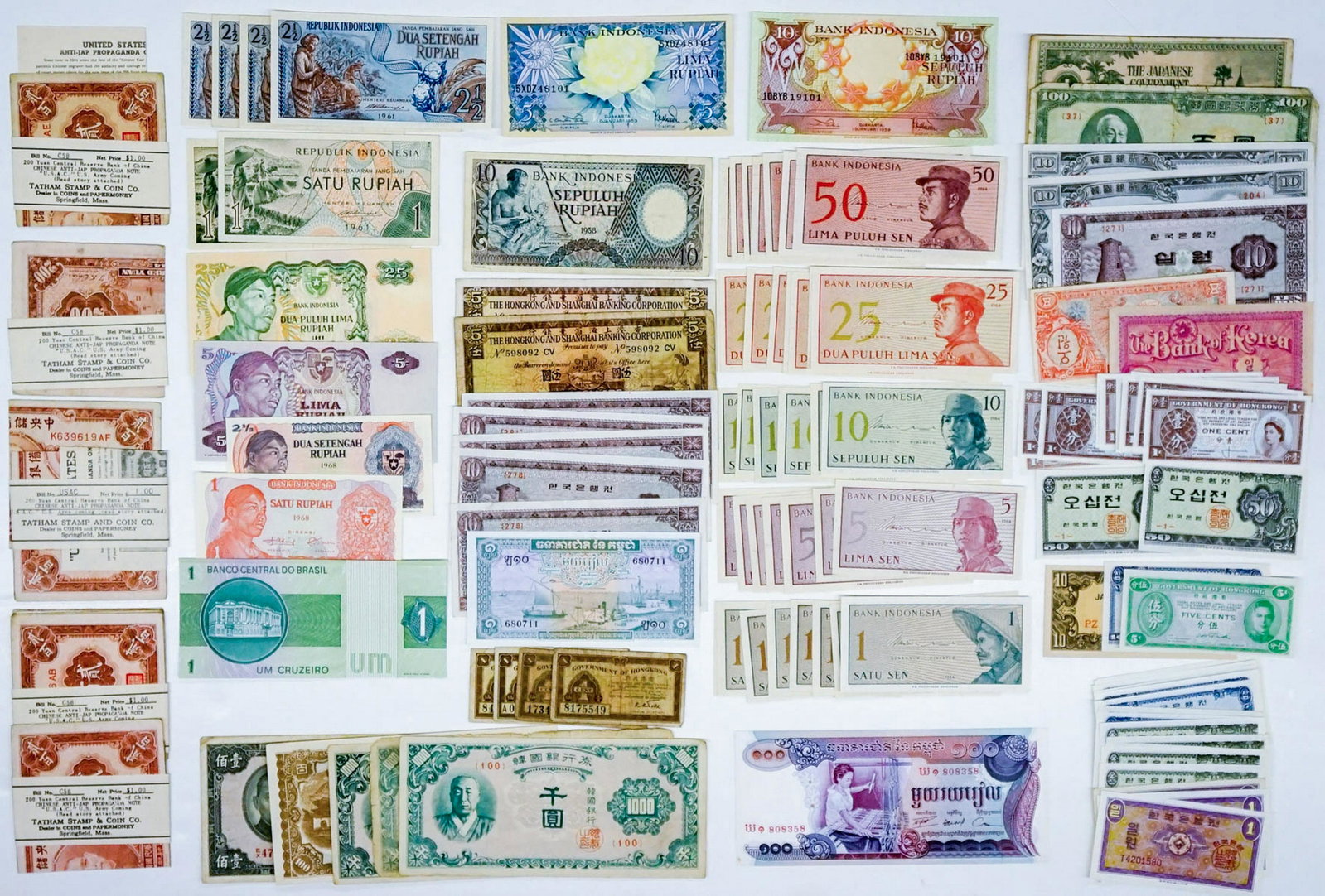 [Korea, Indonesia, Hong Kong, China] Currency: A group of 113 pieces of currency from Hong Kong, Indonesia, China and Korea. Condition varies. Provenance: Amity Art Foundation, Inc. If lot is absent of a condition report a condition report may be 