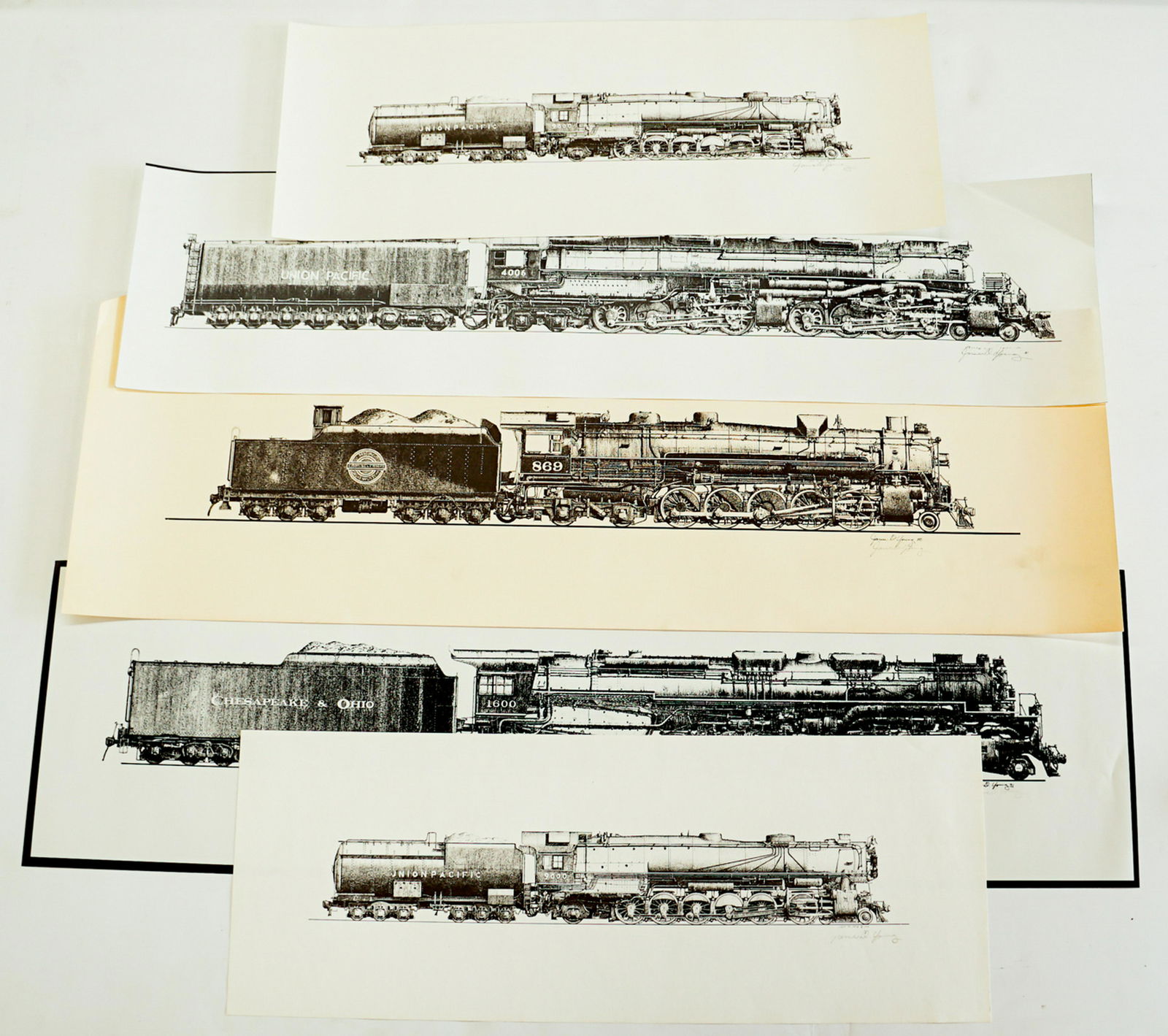 James D. Young Signed Railroad Prints (5): A group of five locomotive signed prints by James D. Young. They measure 9 min. x 24 in. to 11.5 in. x 35 in. Unframed, loose and not glued or mounted. VG-EX/EX. If lot is absent of a condition report