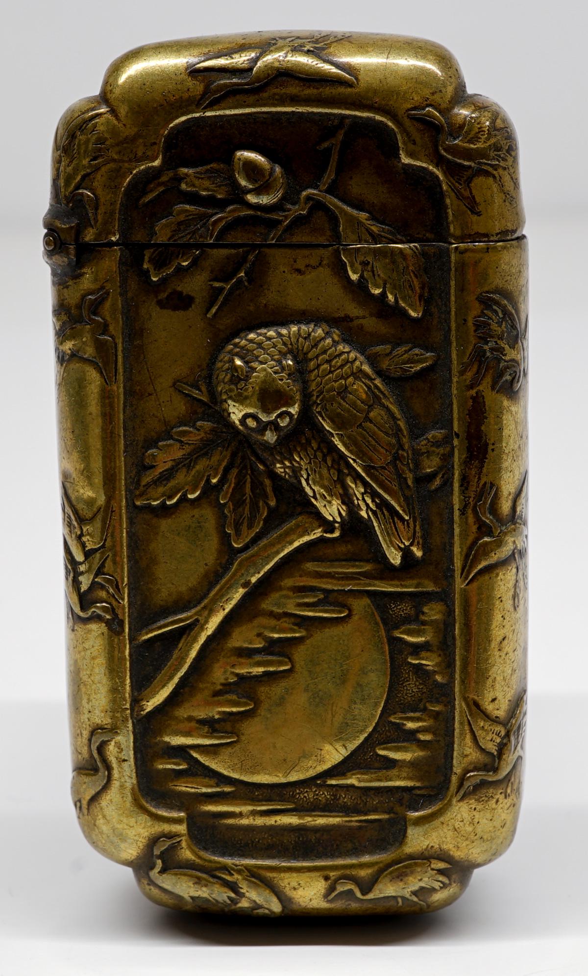 Old Japanese Brass Match Safe: An old Japanese brass match safe. Measures 2.5 in. x 1.375 in. If lot is absent of a condition report a condition report may be requested via email. Condition report is provided as an opinion only and