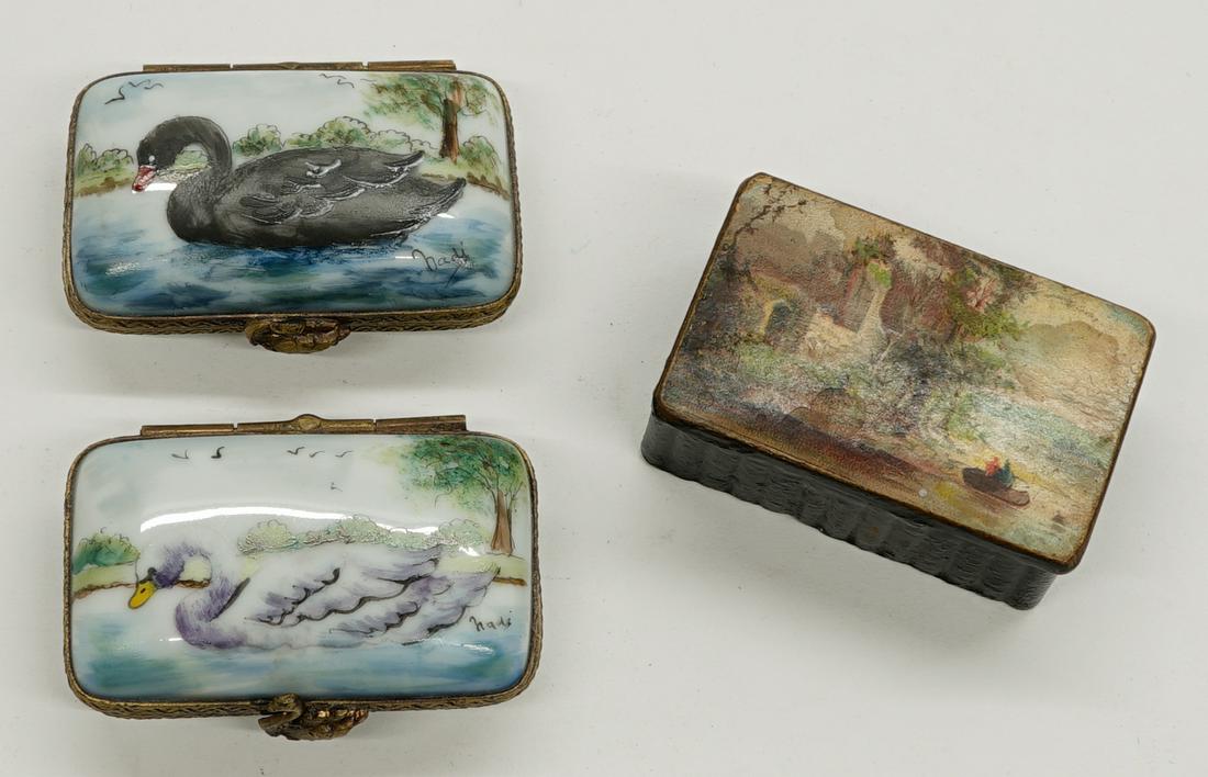 Three Small Hinged Boxes. Limoges: A group of three small hinged boxes. Includes two Limoges signed porcelain box and one lacquerware box. They measure 2 in. x 1.375 in. x .75 in. to 2 in. x 1.25 in. x .875 in. The Limoges porcelain bo