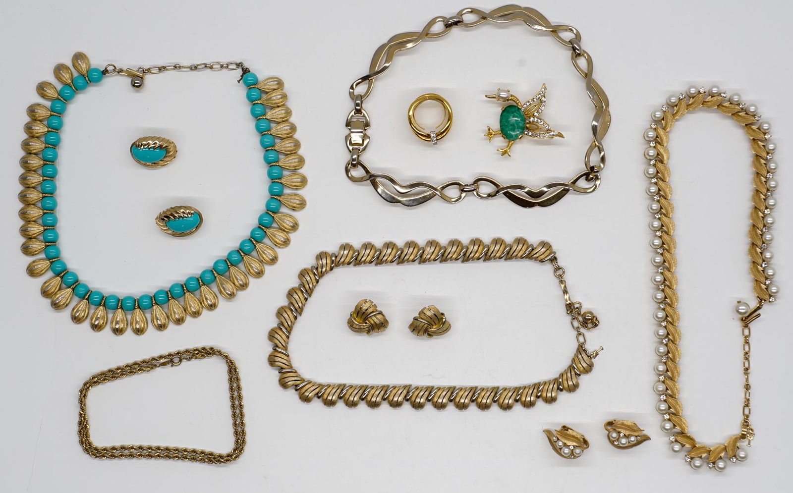 Estate Costume Jewelry with Trifari, Weiss: A group of estate costume jewelry with Trifari, Weiss and Sperry. No signs of damage or repairs. If lot is absent of a condition report a condition report may be requested via email. Condition report