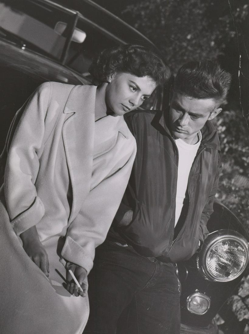 Rebel Without A Cause Movie Still by Floyd McCarty: James Dean and Natalie Wood in Rebel Without A Cause Warner Brothers, 1955) oversized production movie still. Photographed by Floyd McCarty with photographers rubber stamp verso. Semi-Glossy surface,