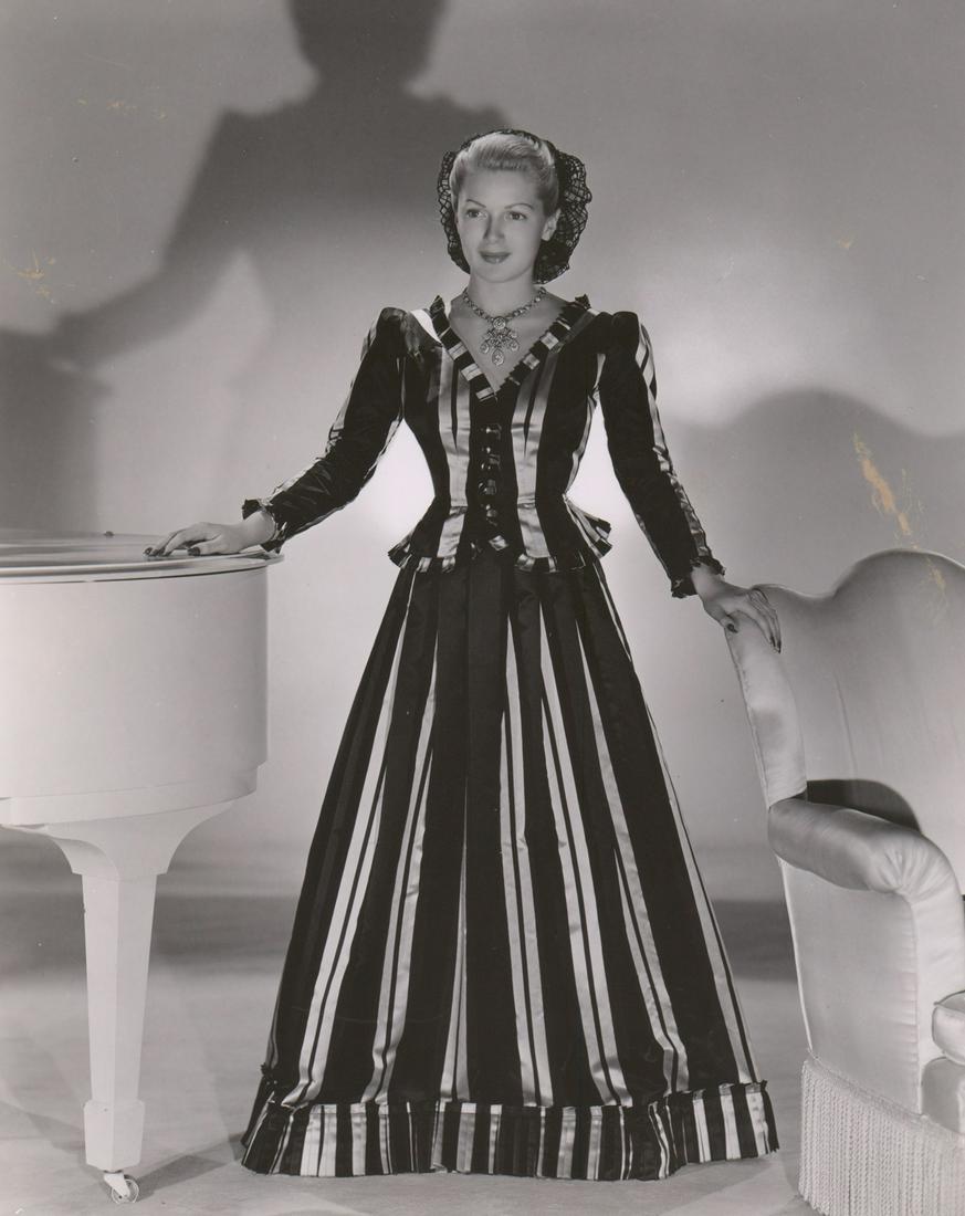 Lana Turner Photographed by Clarence Sinclair Bull: Lana Turner in 'Twenty Little Working Girls' publicity still photographed by Clarence Sinclair Bull. Semi-glossy, double-weight black and white photograph. Measures approximately 8 in. x 10 in. VG-EX/