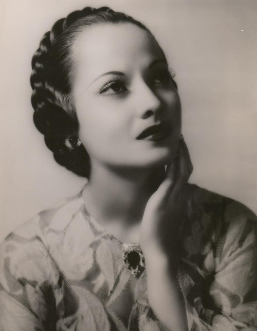 Merle Oberon Vintage Oversized Publicity Photo: Merle Oberon vintage oversized publicity photograph. Semi-glossy surface, double-weight black and white gelatin silver print. Measures approximately 13.75 in. x 10.75 in. VG/VG+ condition with light c