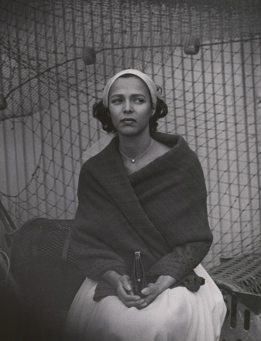 Dorothy Dandridge in Porgy and Bess Photograph: Dorothy Dandridge photographed during production of 'Porgy and Bess' (Columbia, 1959). An oversized production photograph attributed to Phil Stern. Semi-glossy surface, double-weight black and white g