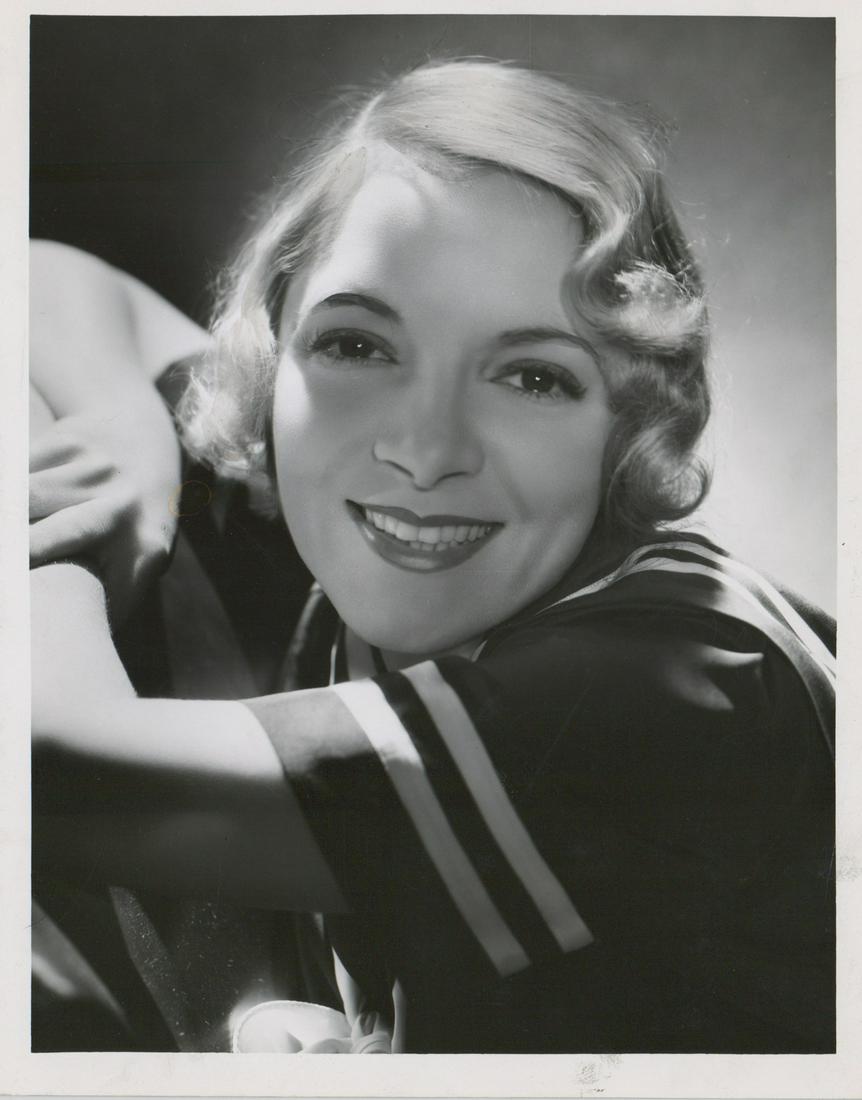 Helen Hayes Photograph by George Hurrell (1933): Helen Hayes photographed by George Hurrell for 'Night Flight'. Dated October 5, 1933 with rubber stamp verso. Semi-glossy surface black and white photograph measuring approximately 10 in. x 8 in. VG-E