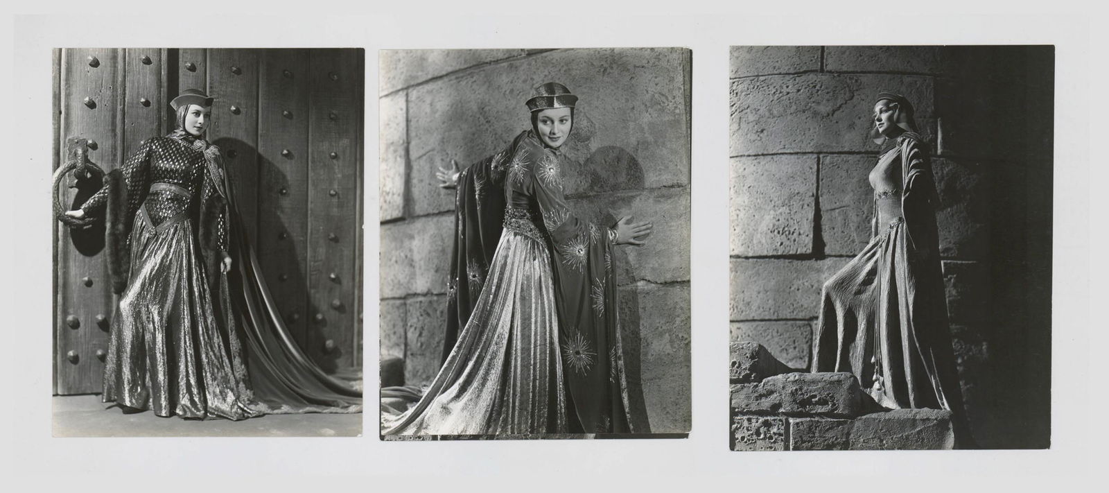 Olivia de Havilland Photographed by Elmer Fryer: Olivia de Havilland in 'Robin Hood' (Warner Brothers, 1938) vintage publicity or production still photo. Photographers rubber stamp on verso. Glossy surface black and white photographs measuring 9.437